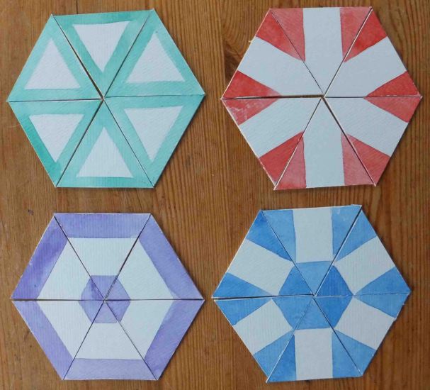 Four ways of producing pattern from a triangular fold