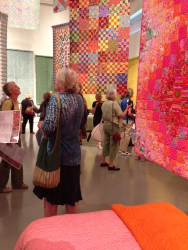Summer School visitors at the Welsh Quilt Centre showing contemporary quilts also on display