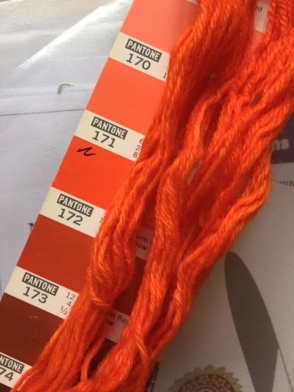 Printed Pantone strip and dyed yarn, showing colours 171 and 172